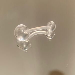 Clear plastic belly button ring
